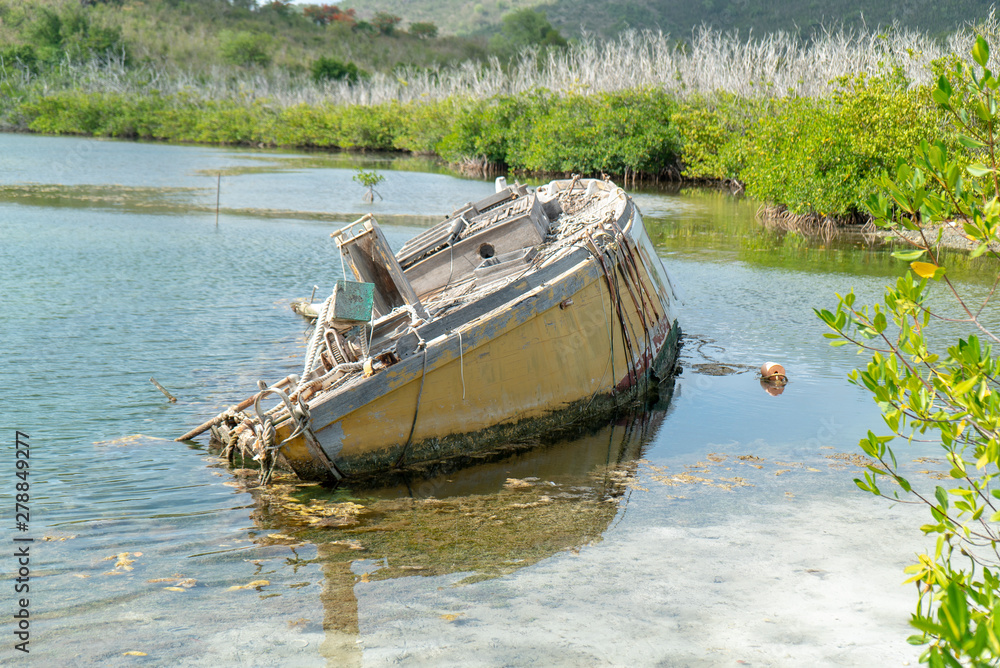 Damage sunken boat on simpson bay lagoon Sint maarten. The boat was sunk after hurricane Irma hit the island in 2017. Damage sunken boat on simpson bay lagoon Sint maarten. The boat was sunk after hurricane Irma hit the island in 2017.