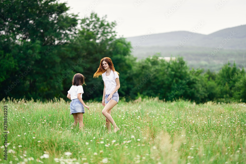 mother and daughter in the field mother and daughter in the field