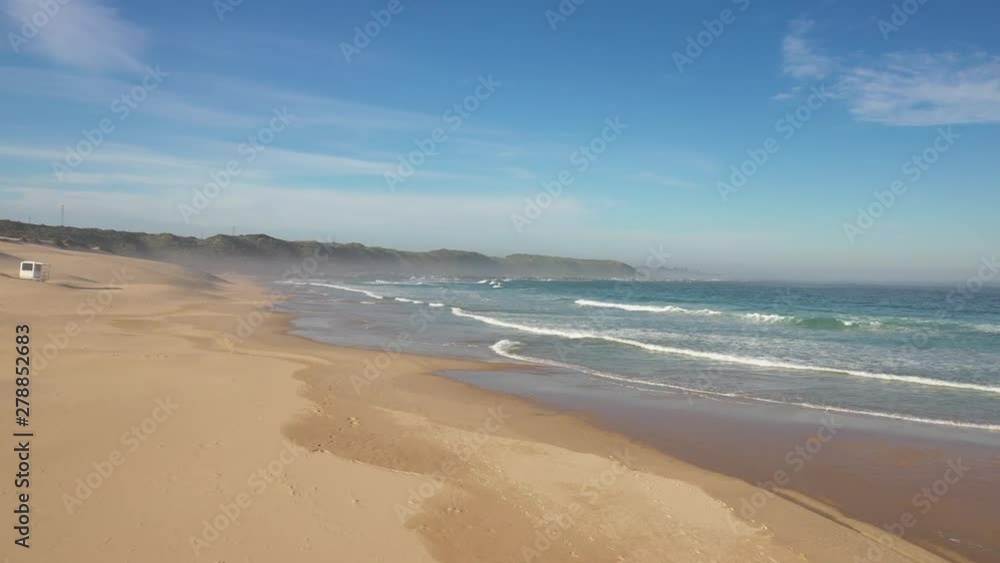 Drone view flying over sand dunes next to the ocean in South Africa Drone view flying over sand dunes next to the ocean in South Africa