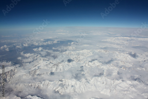 Flying over the Himalayas - a beautiful view from the window of an airplane © Ирина Щелокова