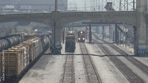 A freight train approaching in the railroad yards of downtown Los Angeles