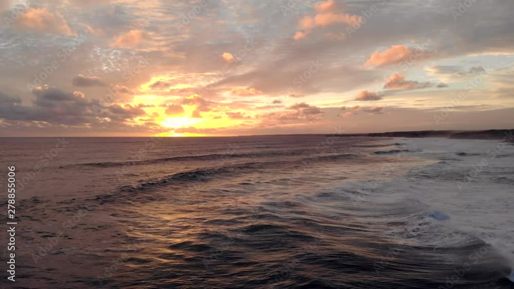 Breathtaking sea sunset landscape with large waves (aerial view) Breathtaking sea sunset landscape with large waves (aerial view)