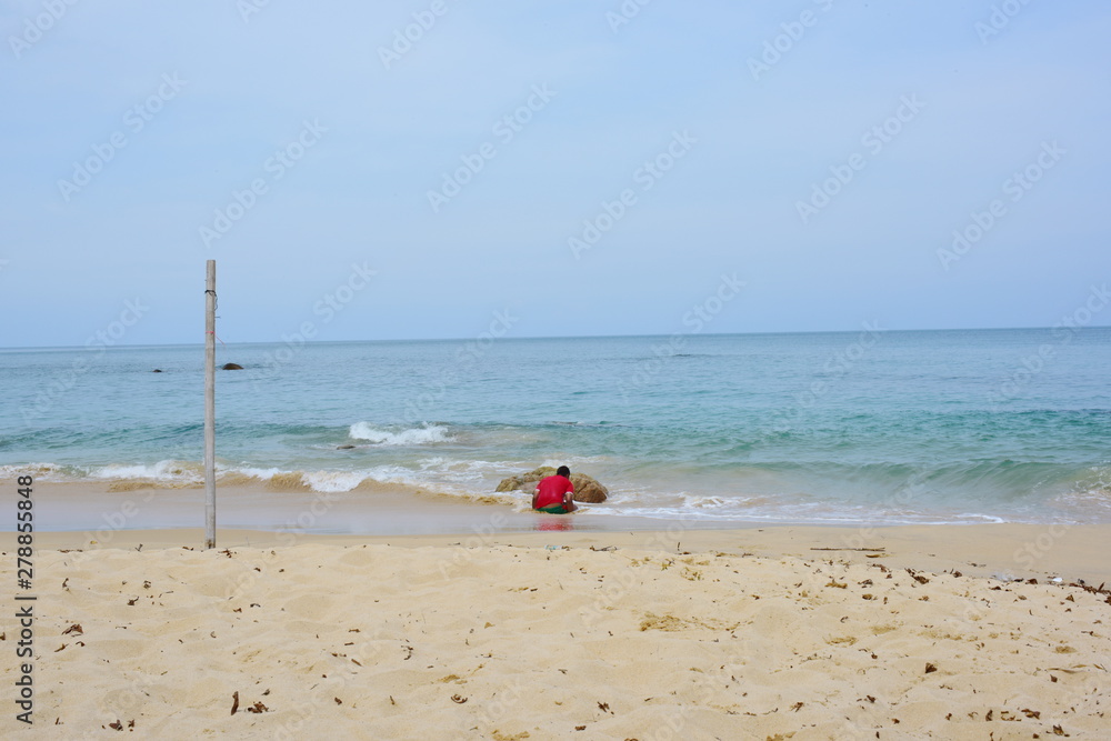 White waves at the beach at the seaside of the island White waves at the beach at the seaside of the island
