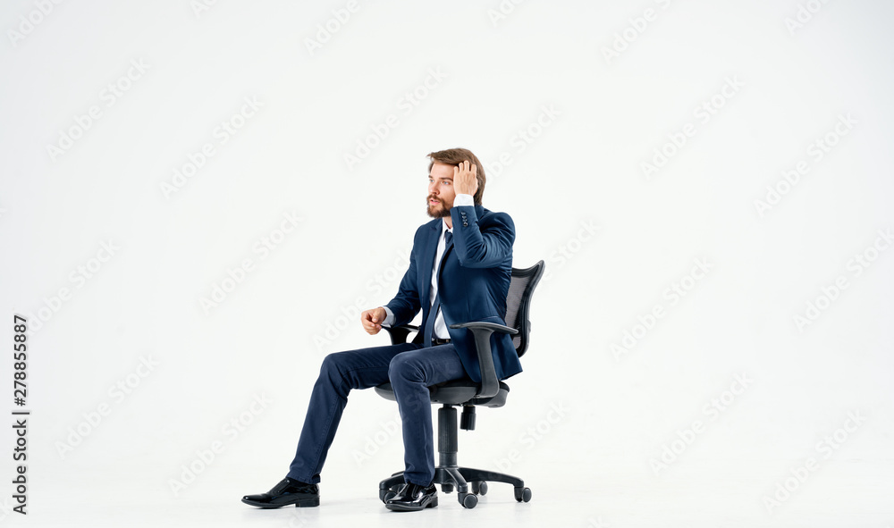 businessman sitting on office chair businessman sitting on office chair