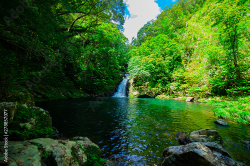 Materiya waterfall in the green forest in Amami oshima Kagoshima sunny day photo