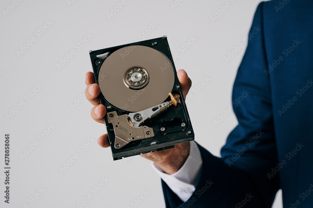 Obraz premium hand with a disk isolated on white background