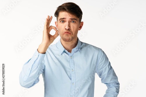 young man talking on the phone isolated on white