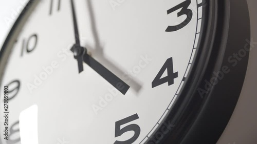 Clock Face 3 Close Up in Time Lapse on Dark Grey Wall in Office