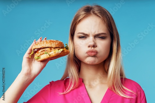 young woman with hamburger