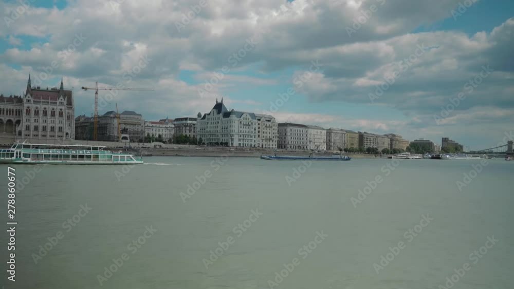 Boat ride through Danube, summer afternoon, leaving budapest parliament Boat ride through Danube, summer afternoon, leaving budapest parliament