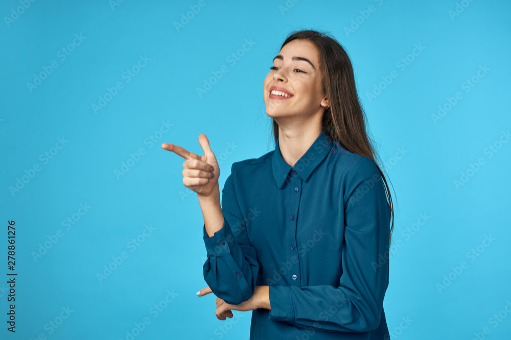 young woman pointing at copyspace young woman pointing at copyspace