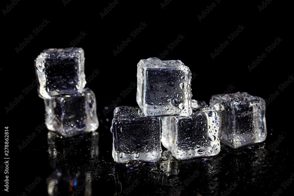 ice cubes reflection on black table background. ice cubes reflection on black table background.