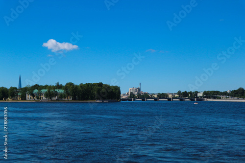 Summer view of the city of saint petersburg with neva river and stone island under clear blue sky