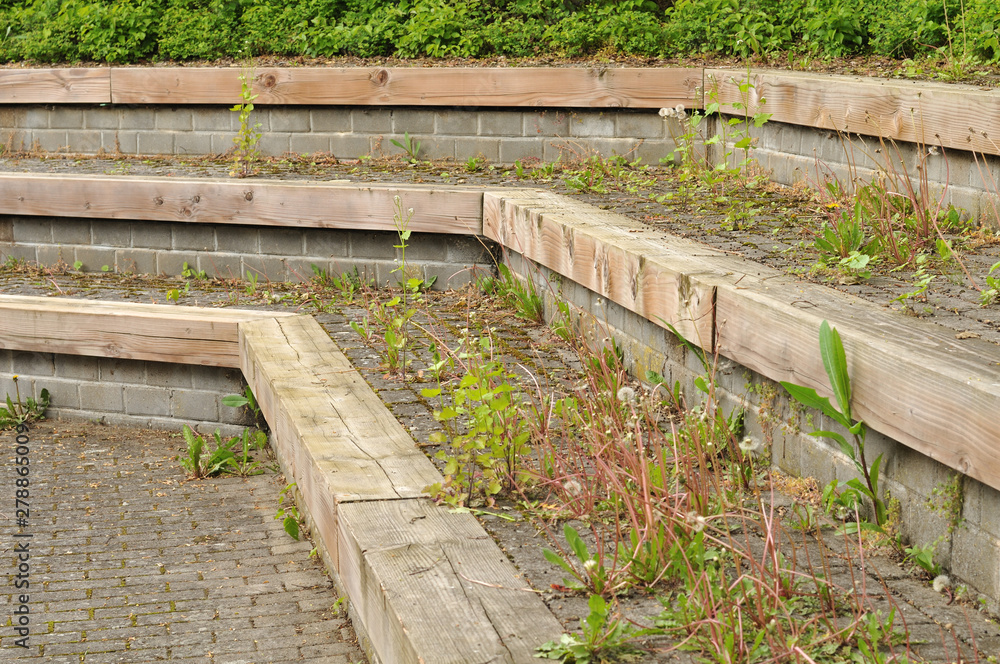 large steps of wood and sett stones in a park