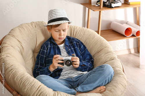Cute little photographer wi...