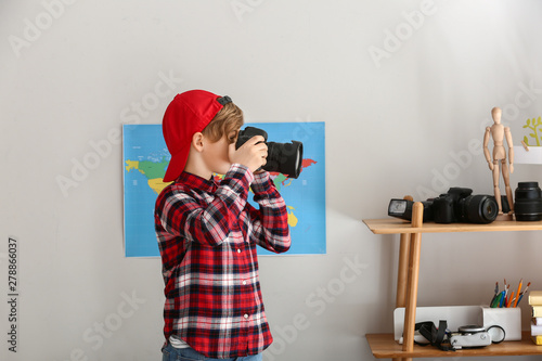 Cute little photographer wi...