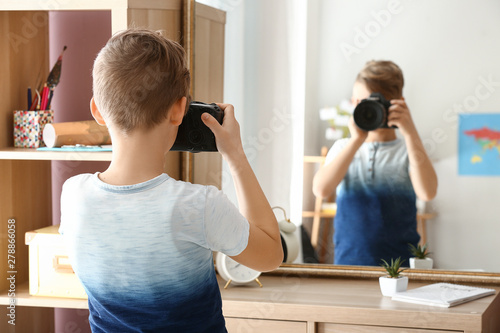 Cute little photographer wi...