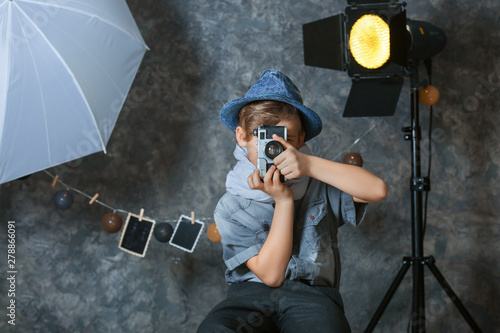 Cute little photographer wi...