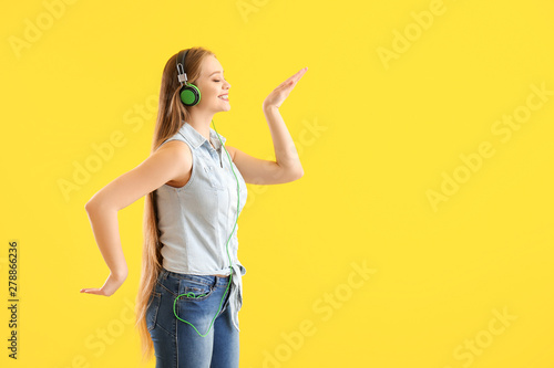 Beautiful young woman liste...