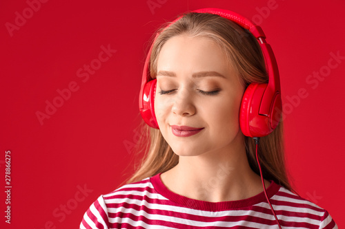 Beautiful young woman liste...