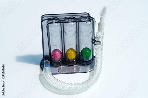 Triflow incentive spirometer for inhalation exercise on white background, Triball  photo