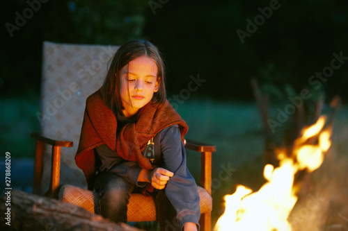 Little girl nature bonfire