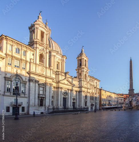 Sant Agnese Church at dawn in the Piazza Navona with Egyptian obelisk and Four Rivers Foutain in the background - Rome, Italy.