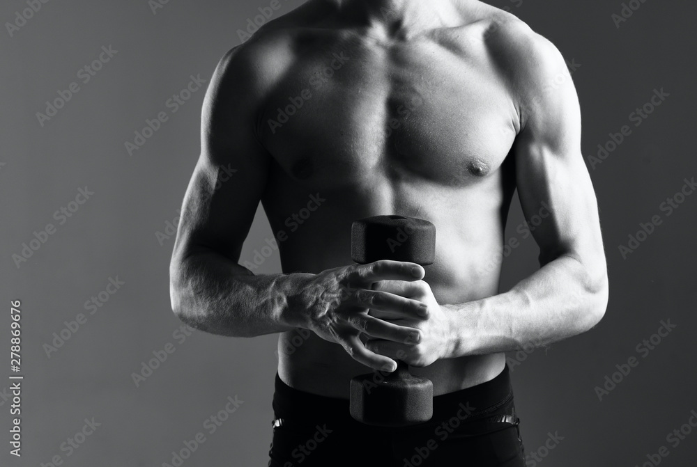 Naklejka premium muscular man with dumbbells