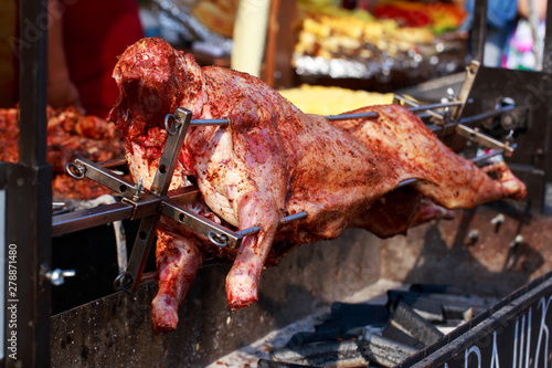 Grilled sheep carcass on a spit photo