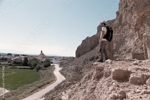 backpacker traveler with hat and white shirt