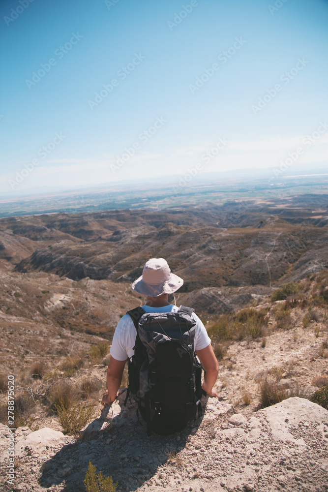 backpacker traveler with hat and white shirt backpacker traveler with hat and white shirt