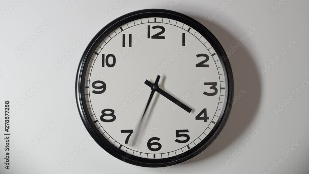 Clock Face Close Up in Time Lapse on Wall in Office Clock Face Close Up in Time Lapse on Wall in Office
