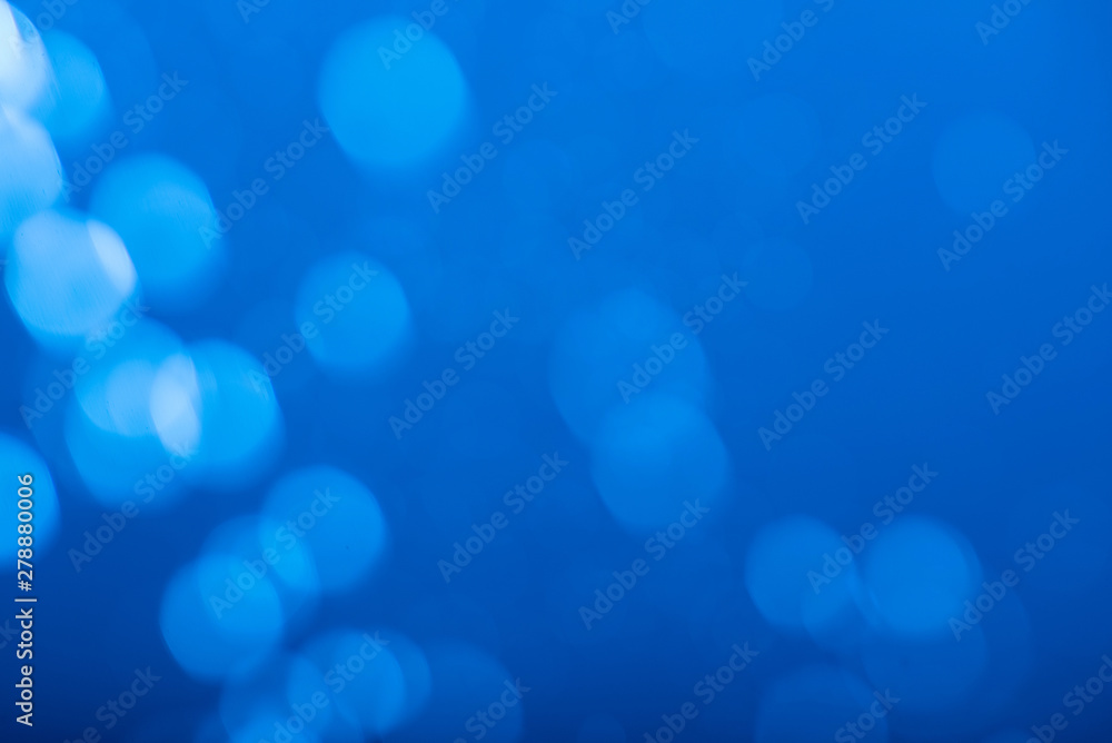 Naklejka premium Abstract blue bokeh background.