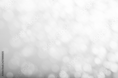 White bokeh abstract texture. Blurred bright light at night.