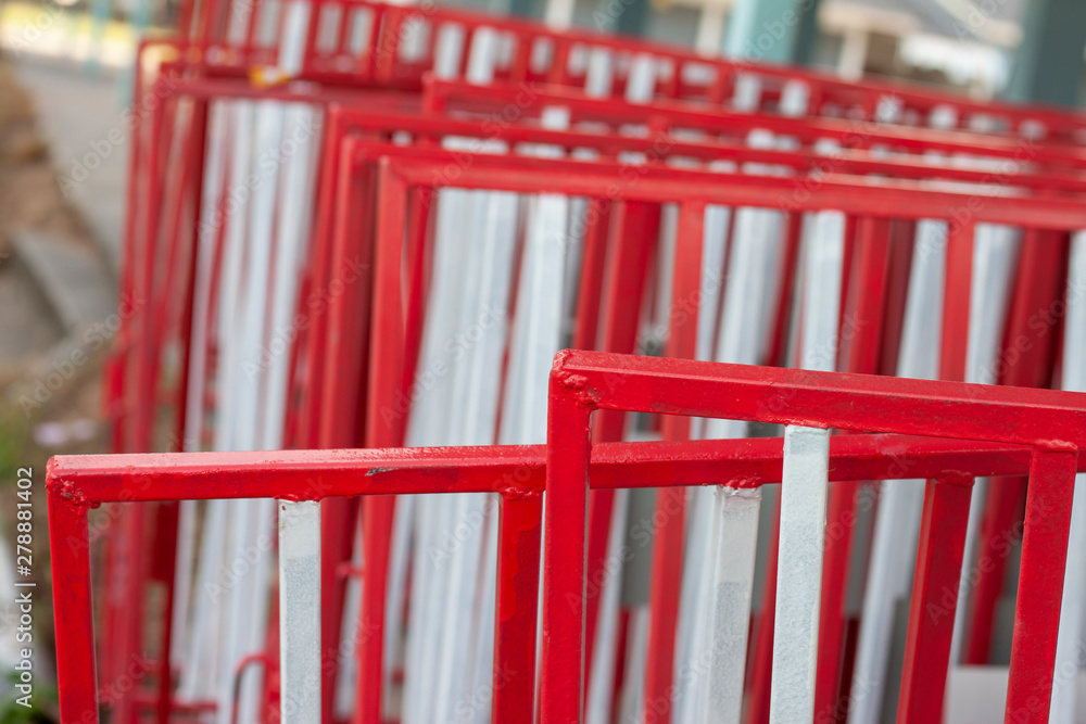 White and red iron fence for traffic barrier placed stack many. White and red iron fence for traffic barrier placed stack many.