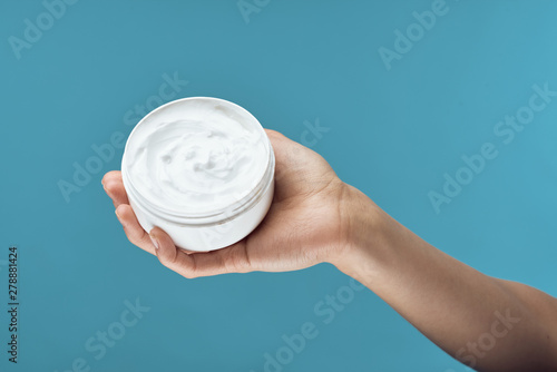 hand with cream isolated on white background