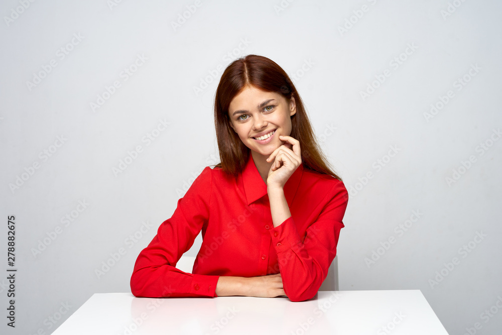 young woman sitting at desk and thinking young woman sitting at desk and thinking