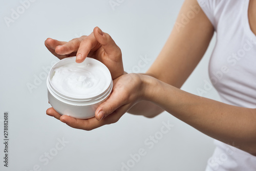 hands holding a cup of coffee isolated on white