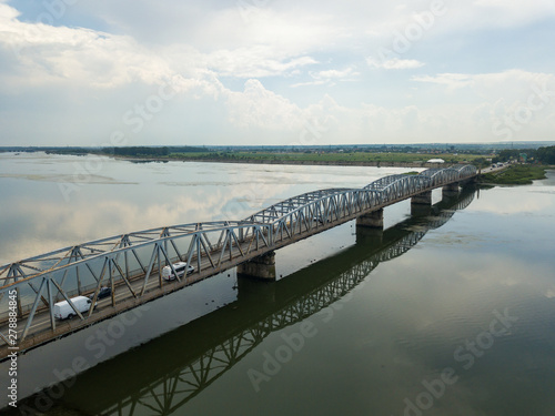 Wallpaper Mural Aerial Drone Flight: View of the bridge over the river with cars. Olt river, Romania Torontodigital.ca