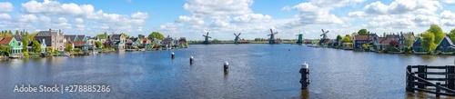 Fotografie, Obraz Panorama view of Windmills at Zaanse Schans and Zaandijk town in Netherlands