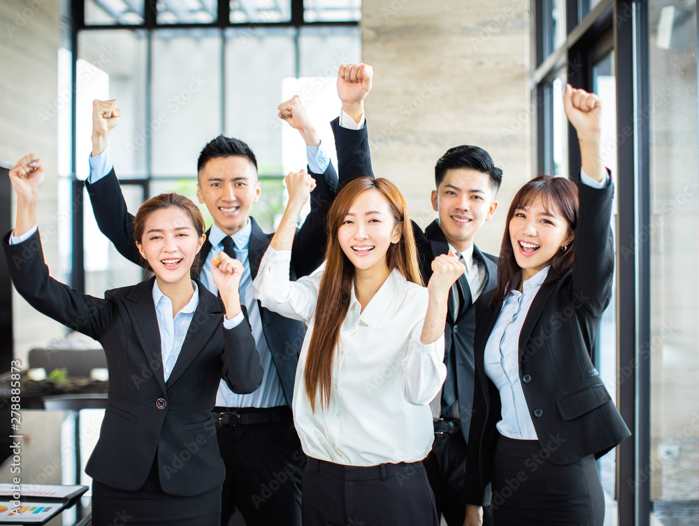 confident asian business team hands up and celebrating confident asian business team hands up and celebrating