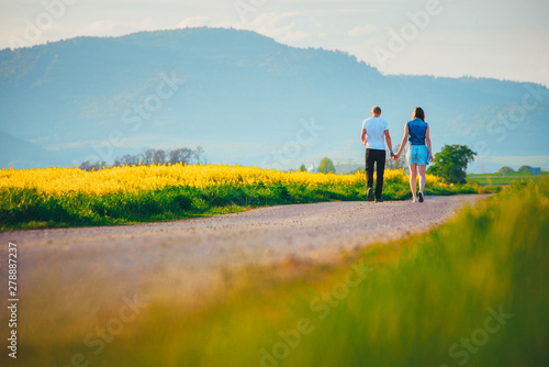 Couple walking in spring nature. Man and woman  people relationship concept photo