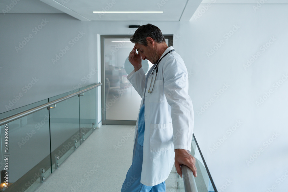 Male surgeon standing in the corridor in hospital