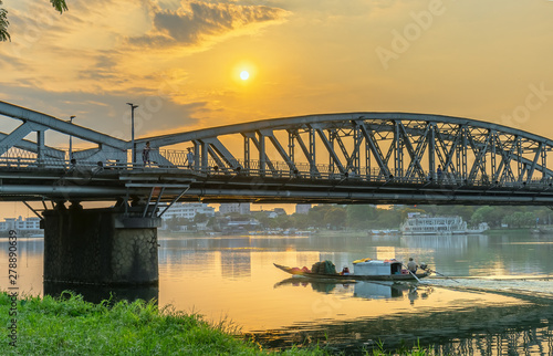 Dawn at Trang Tien Bridge. This is a Gothic architectural bridge spanning the Perfume river from the 18th century designed by Gustave Eiffel in Hue, Vietnam © huythoai
