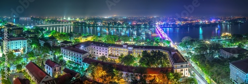 Canvas Print Panoramic city colorful night sparkling view from above in Hue, Vietnam