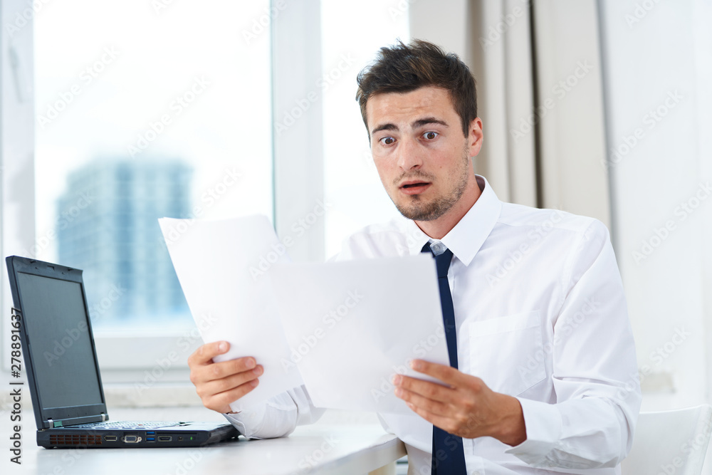 businessman working on laptop in an office businessman working on laptop in an office
