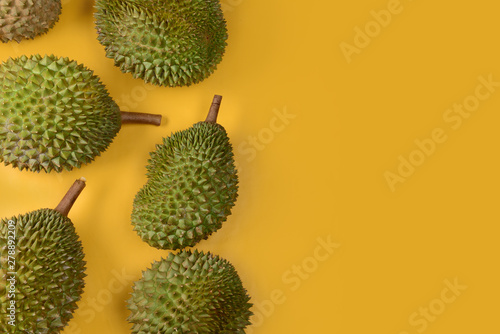 durian on bright yellow background with copyspace
