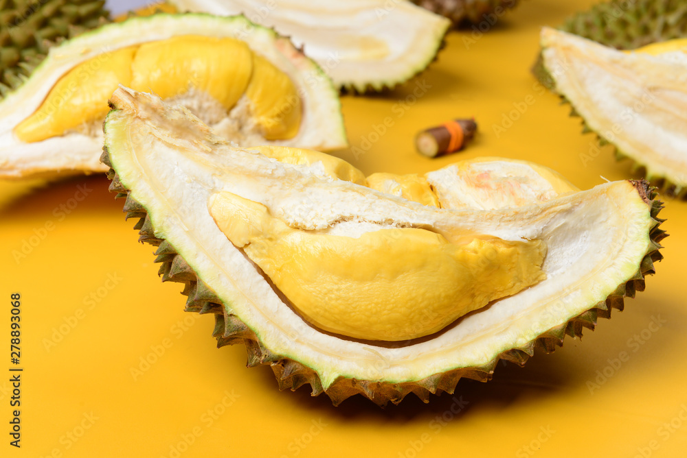 musang king durian with yellow backgroiund musang king durian with yellow backgroiund