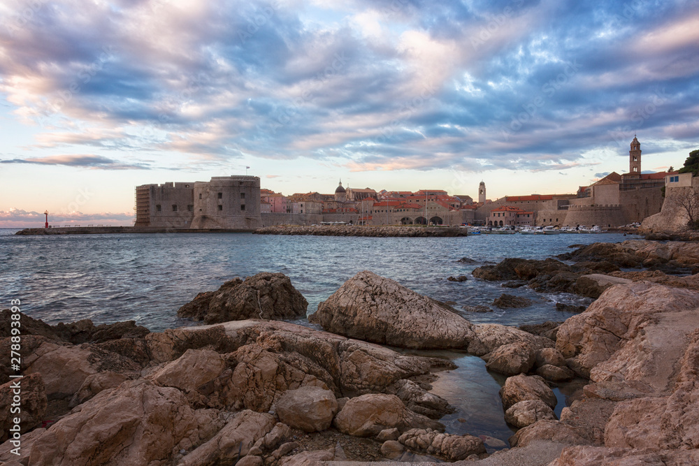 Dubrovnik, a landscape overlooking the old town and large stones in the foreground, Croatia
