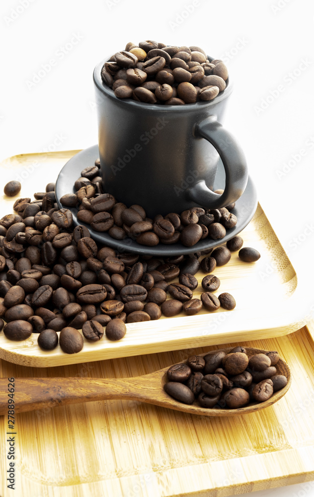 Coffee beans in a coffee mug on a white background Coffee beans in a coffee mug on a white background